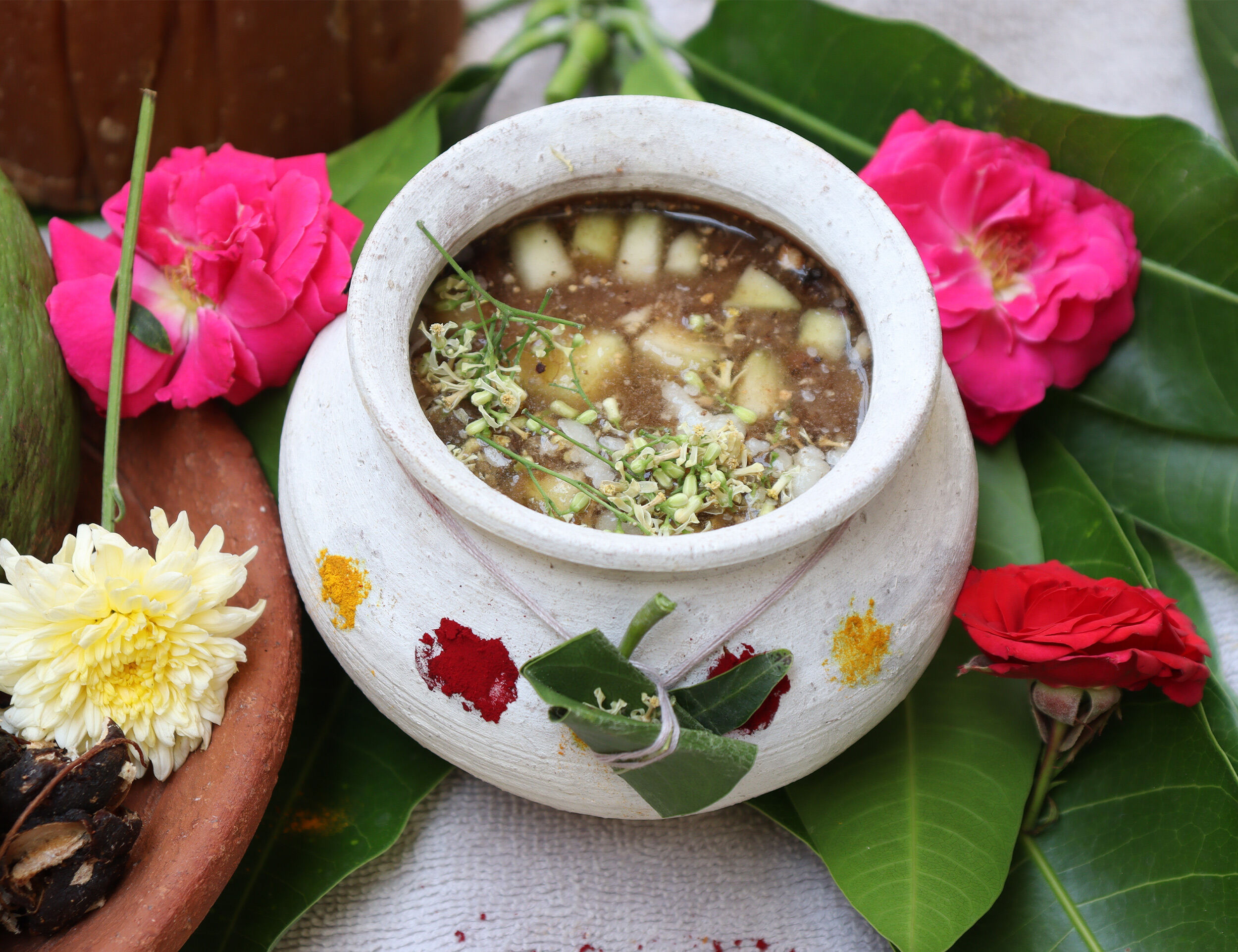 Traditional Ugadi Pachadi served in a clay pot, surrounded by mango leaves, flowers, and festive offerings, symbolizing the six flavors of life.
