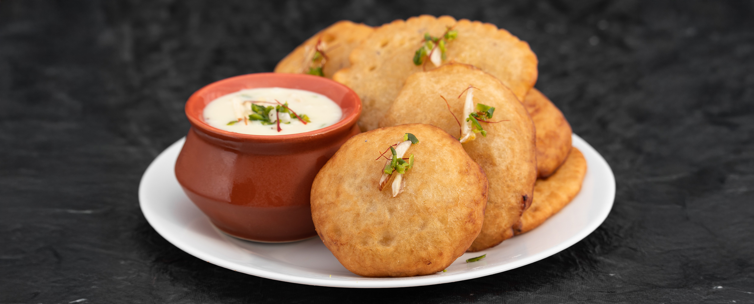Traditional Malpua and Rabri, popular Indian sweets for a Diwali feast. Traditional Malpua and Rabri, popular Indian sweets for a Diwali feast.