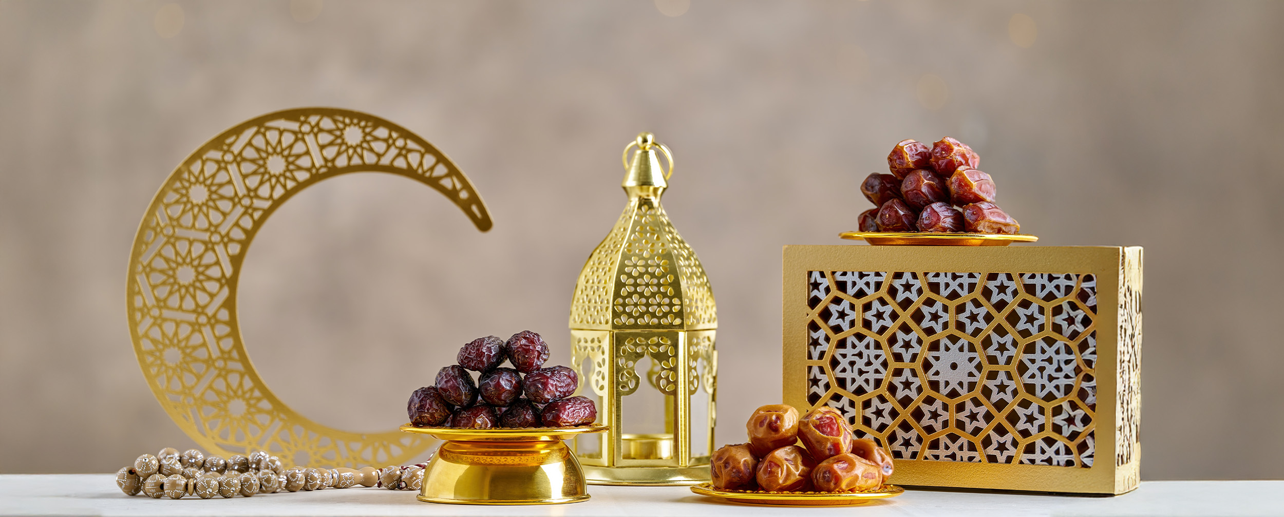 Golden crescent moon, lantern, and dates arranged on a festive table setting for Ramadan, symbolizing the traditions and significance of the holy month in 2025. Golden crescent moon, lantern, and dates arranged on a festive table setting for Ramadan, symbolizing the traditions and significance of the holy month in 2025.