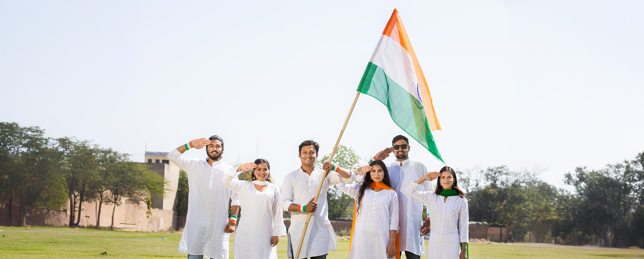 A group of people celebrating and saluting on republic day with indian national falg in hand A group of people celebrating and saluting on republic day with indian national falg in hand