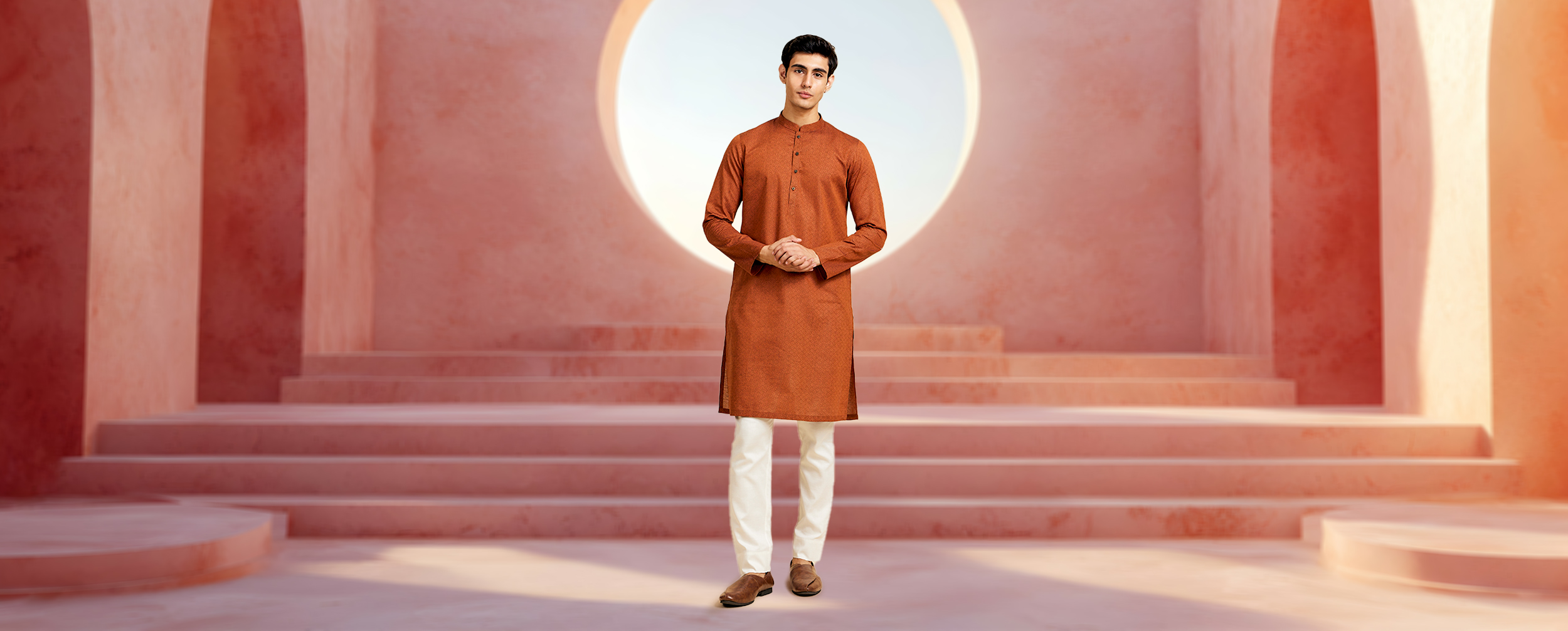 A Man in a casual orange kurta and contrast pajamas A Man in a casual orange kurta and contrast pajamas