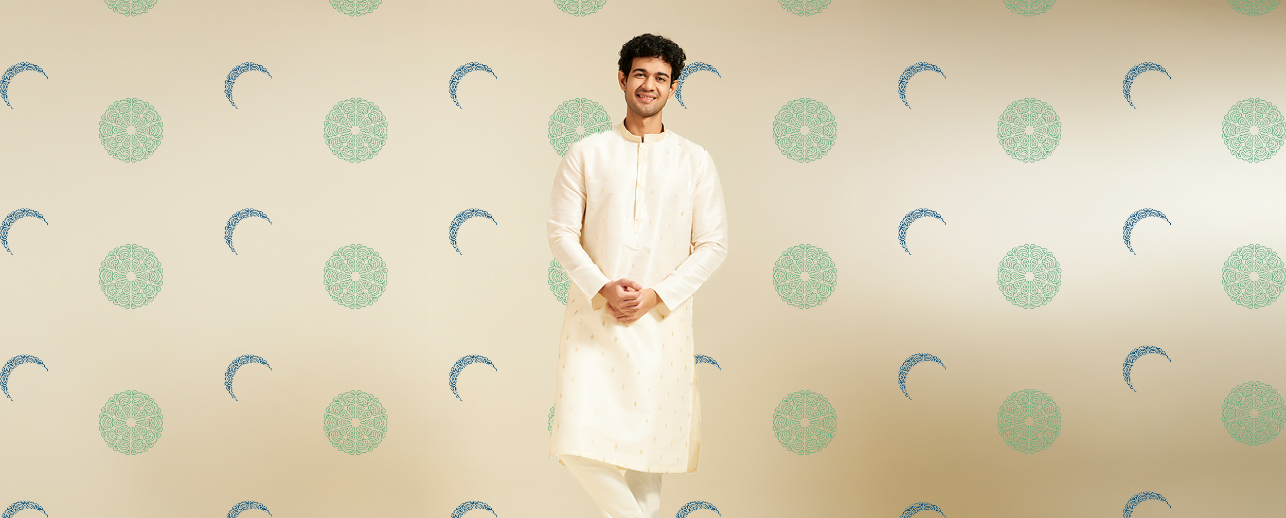 Man wearing an elegant off-white embroidered kurta, perfect for a stylish Eid outfit
