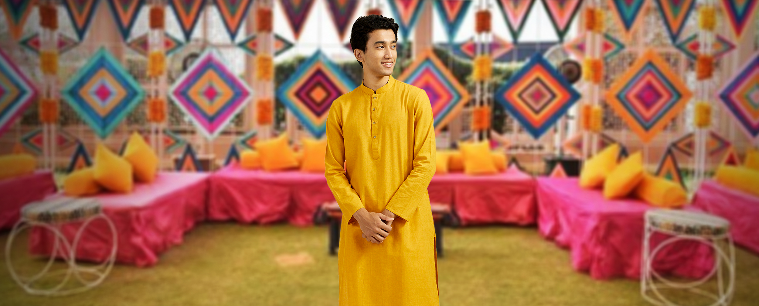 A man wearing yellow kurta for lohri celebration A man wearing yellow kurta for lohri celebration