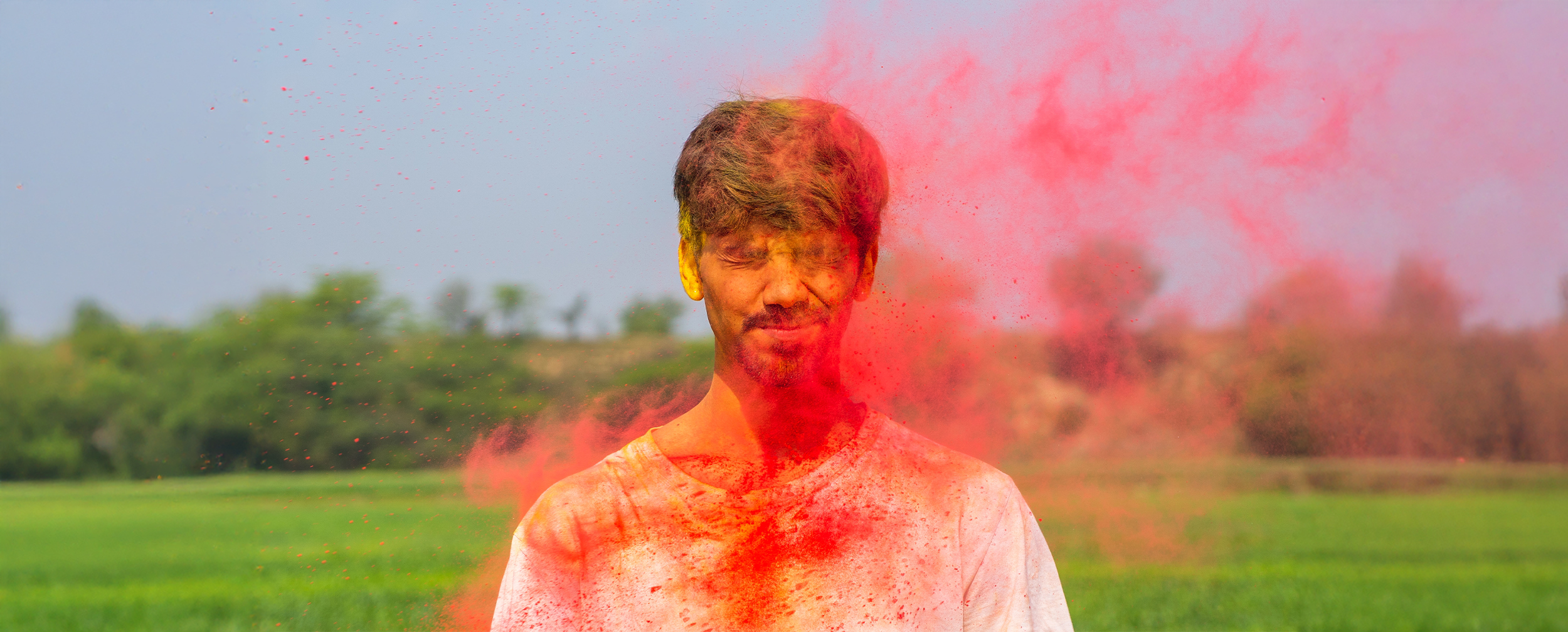 A boy with colours on his hair and face A boy with colours on his hair and face