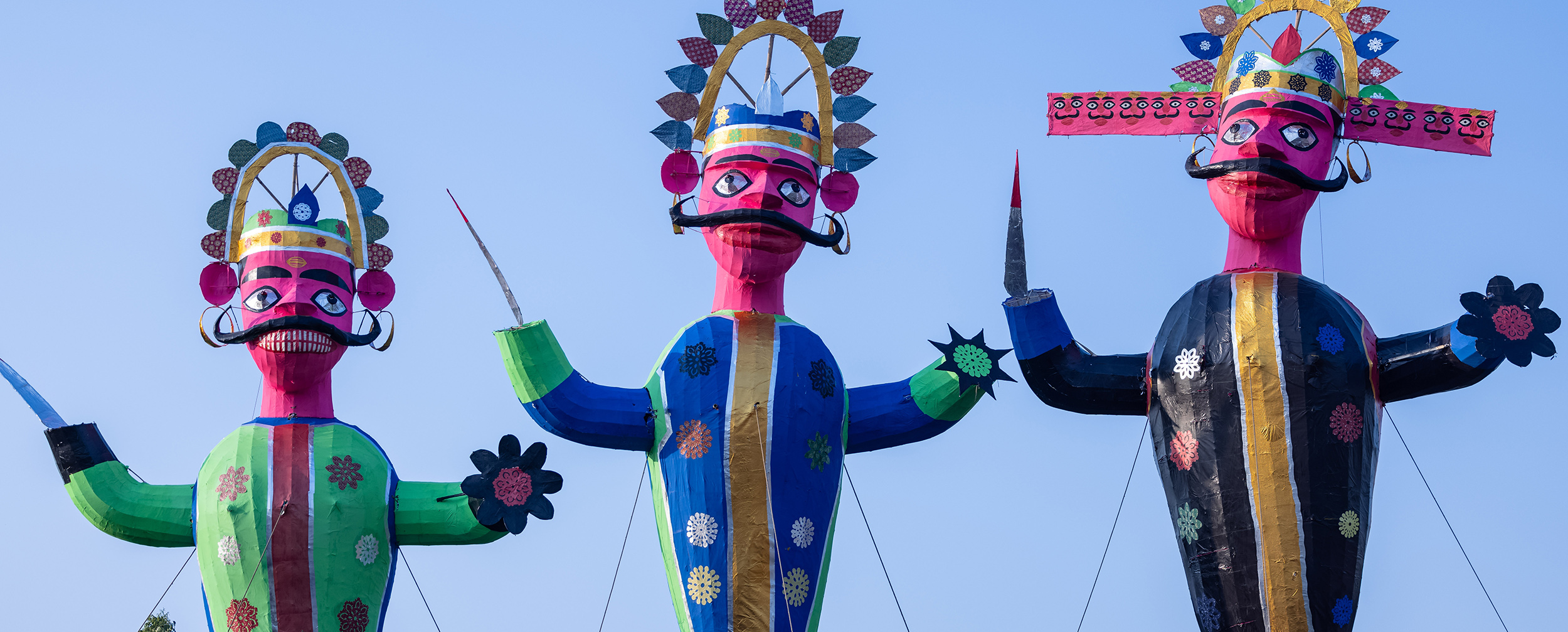 Towering effigies of Hindu demon Ravana and his allies, ready for the 'Ravan Dahan' ritual during the Dussehra festival.