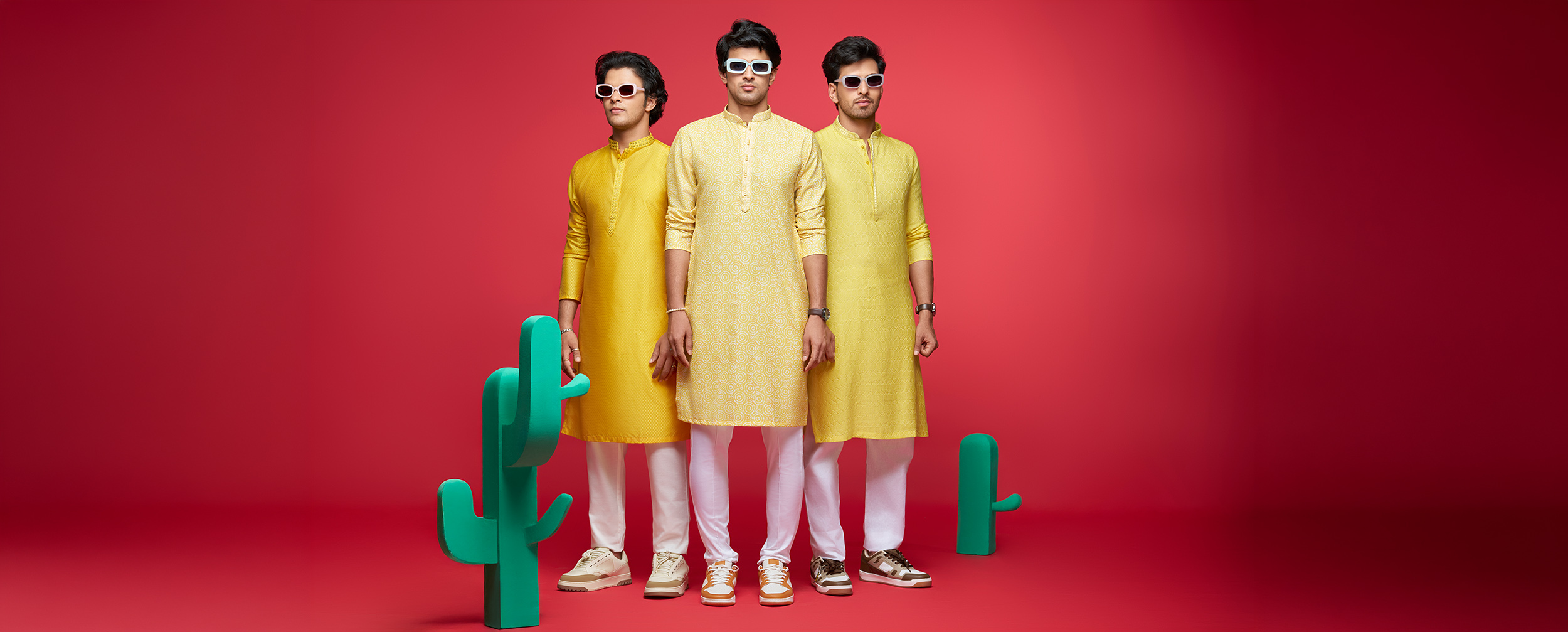 Three men in structured yellow kurtas showcase flattering fits for athletic builds and broad shoulders with contemporary styling.